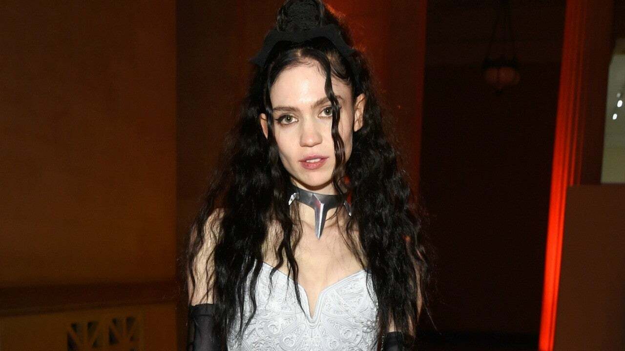 Grimes Shares Large Back Tattoo of 'Excellent Alien Scars'