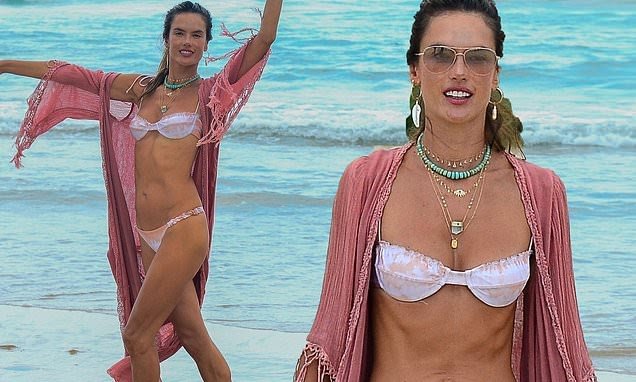 Alessandra Ambrosio shows off her toned figure in tiny white and pink two-piece as she soaks up the sun on one of Brazil's most beautiful beaches!!!