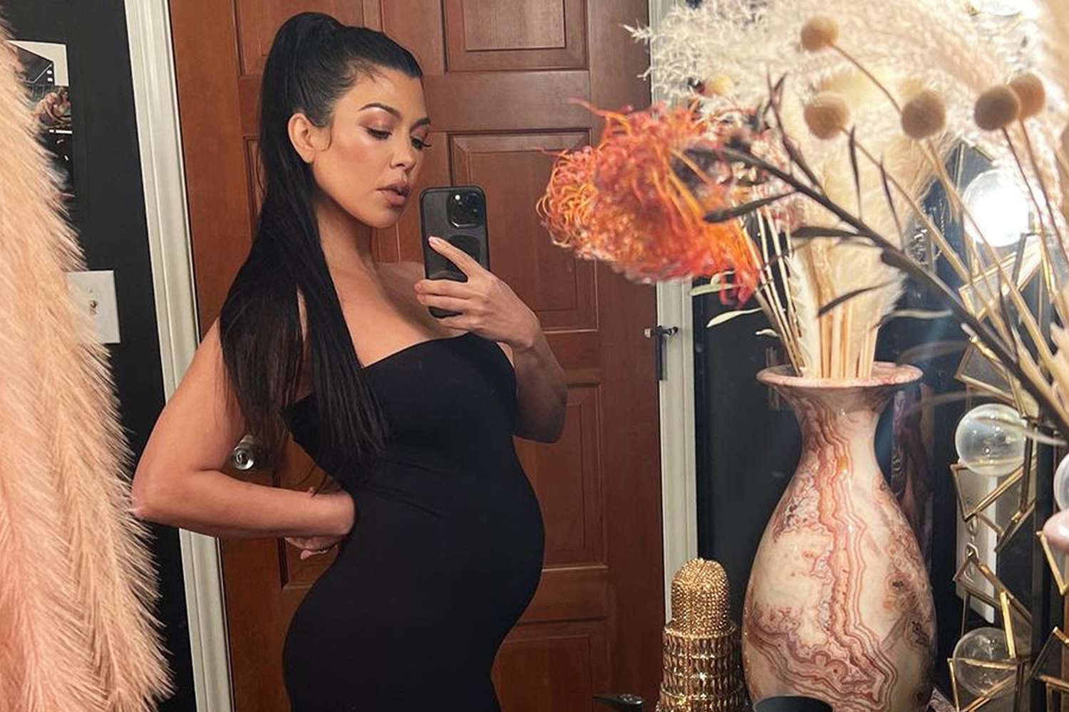 Pregnant Kourtney Kardashian Shows Off Her Baby Bump in Striking Photos 17